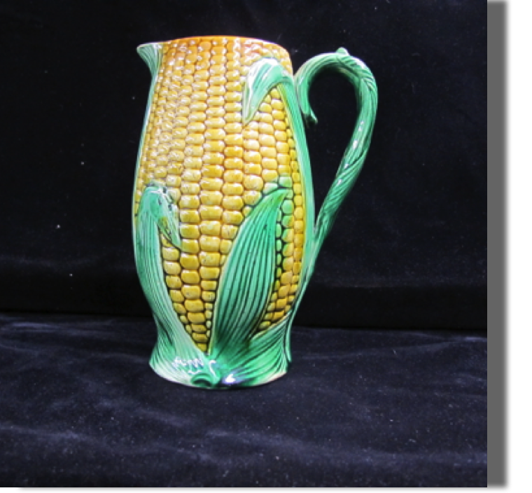 Corn pitcher, may be a small chip on lip of spout, would need to confirm