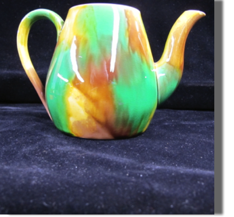 Believe English, possibly Wedgwood, and described as a 'widow mourning' very small chip on lip of spout (old)